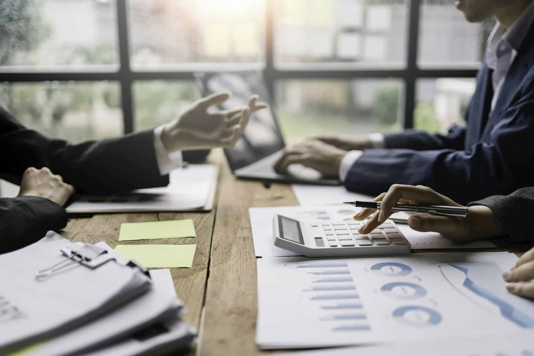 Businessmen meeting to plan, analyze, graph and chart business growth. to plan for new business expa